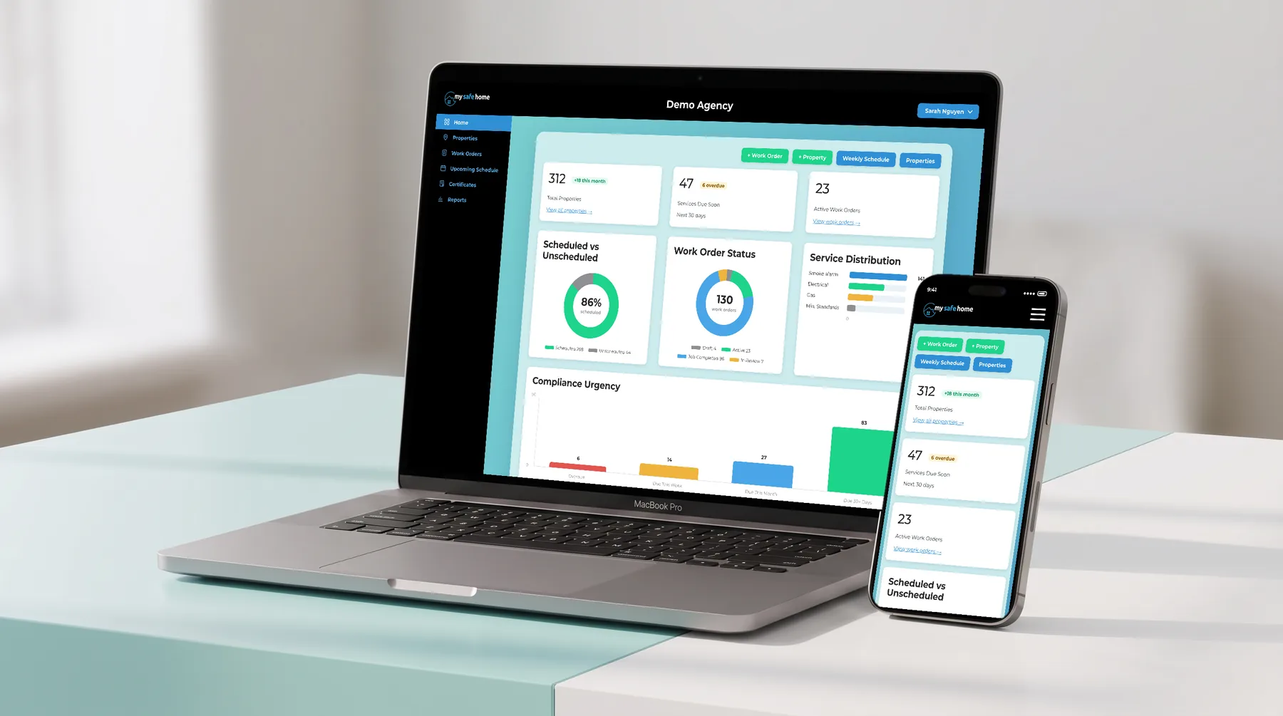 My Safe Home portal on a MacBook and an iPhone on a desk, showing the Demo Agency dashboard